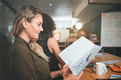 Buy stock photo Shot of a diverse group of businesspeople sitting together in the office and planning during a meeting