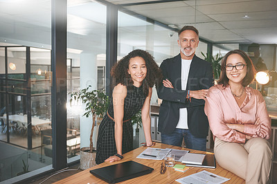 Buy stock photo Shot of a diverse group of businesspeople standing together in the office during a meeting