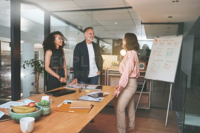 Buy stock photo Shot of a diverse group of businesspeople standing together in the office during a meeting