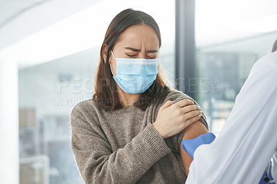 Buy stock photo Shot of an unrecognizable doctor giving a patient an injection in an office