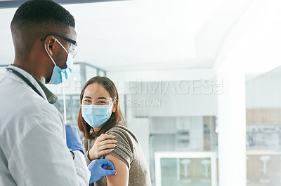 Buy stock photo Shot of a young patient preparing to get an injection in an office