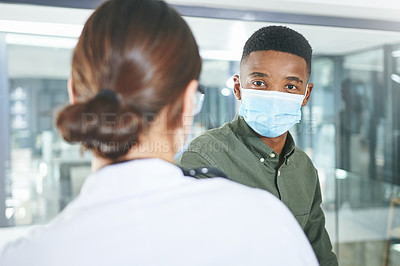Buy stock photo Shot of an unrecognizable doctor talking to a patient in an office