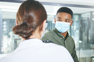 Buy stock photo Shot of an unrecognizable doctor talking to a patient in an office