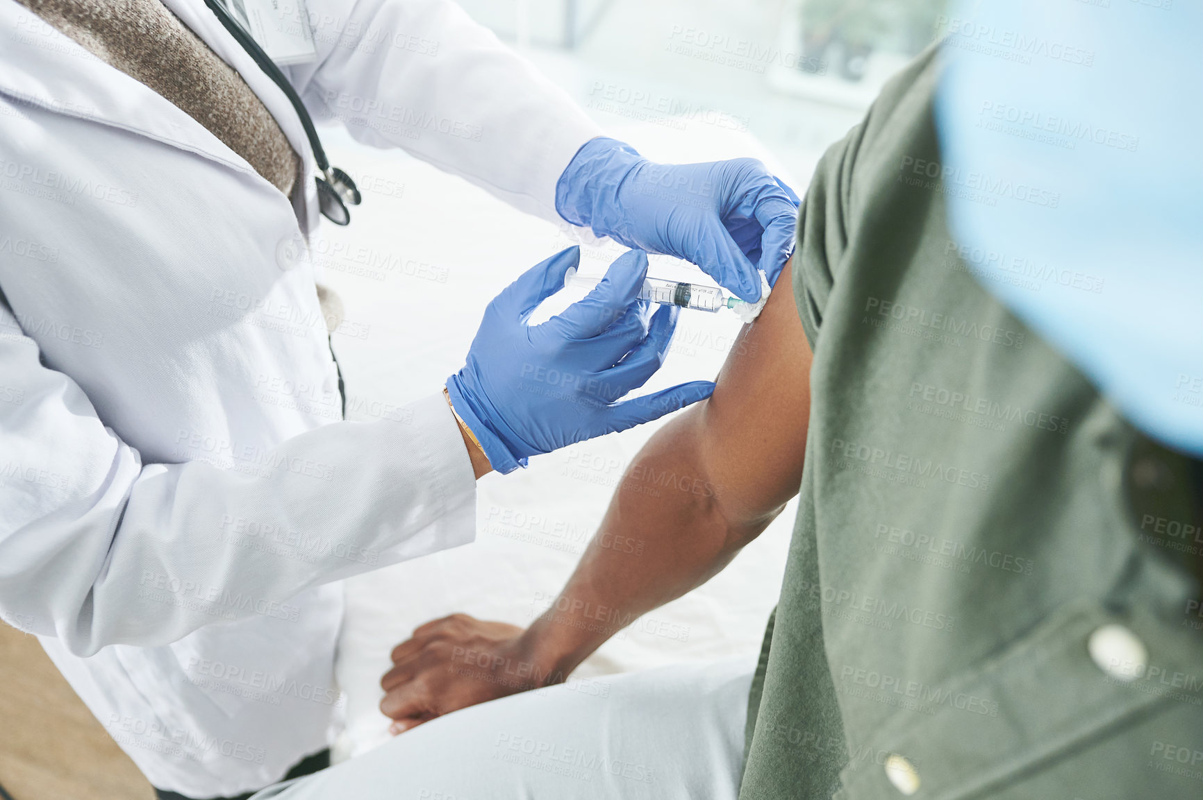 Buy stock photo Shot of an unrecognizable doctor giving a patient an injection in an office