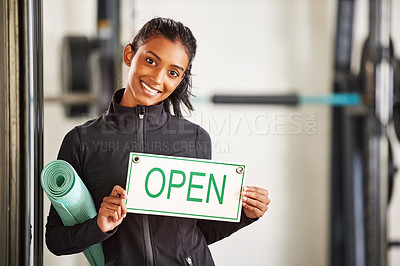 Buy stock photo Woman, portrait and open sign in gym for fitness with training, health workout and marketing. Female personal trainer, signage and welcome in wellness club for startup advertising, exercise and sport