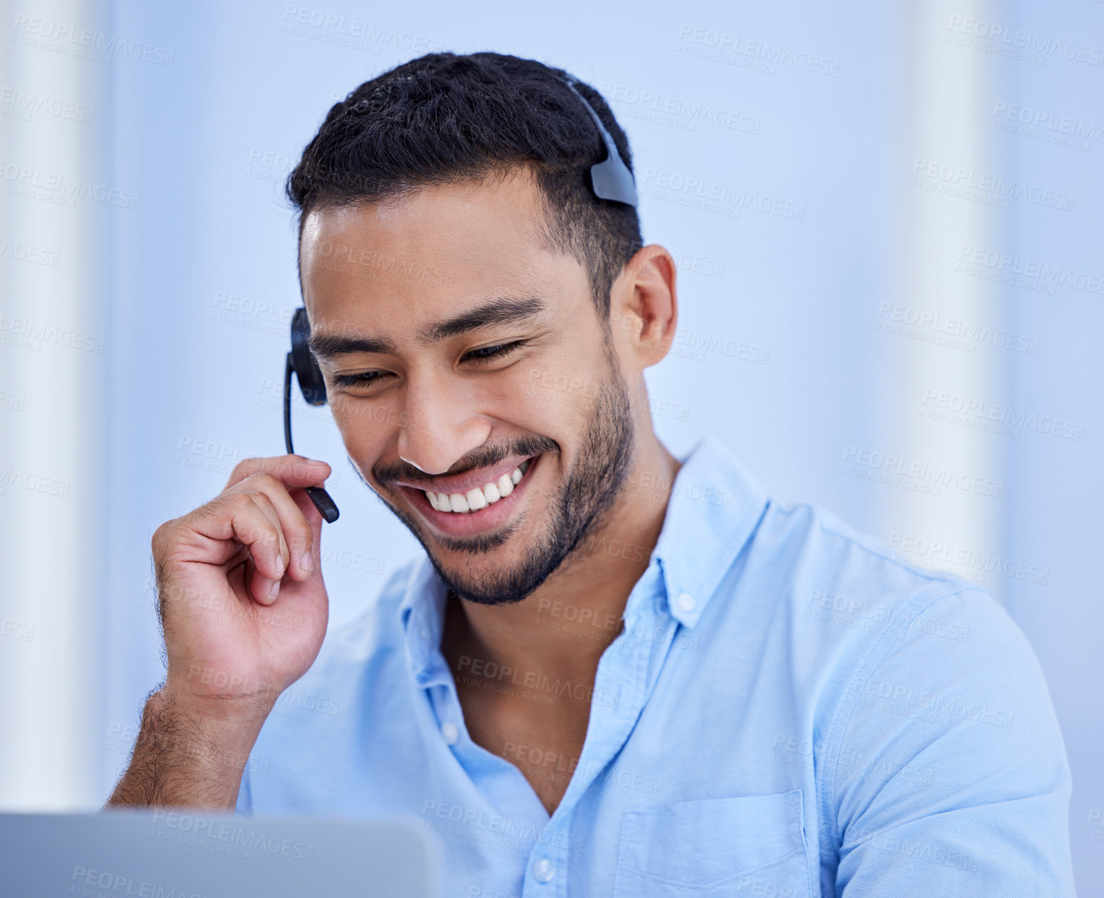 Buy stock photo Shot of a young businessman working in a call center