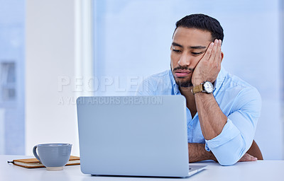 Buy stock photo Shot of a businessman looking depressed at work