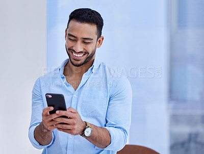 Buy stock photo Happy asian man, phone and smile for communication, social media or chatting at the office. Businessman smiling and typing on mobile smartphone app for texting, online chat or networking at workplace