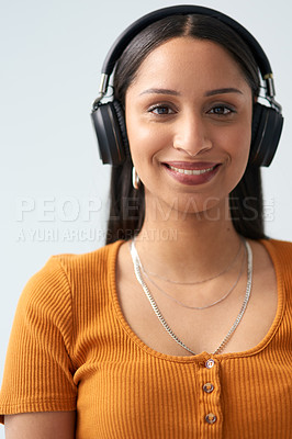 Buy stock photo Woman, smile and portrait with headphones in studio background for listening to music, podcast or radio. Girl, happy and headset on with playlist subscription for streaming audio, sound or song