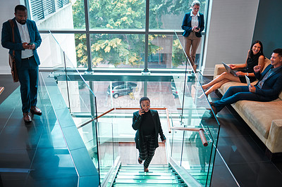 Buy stock photo Corporate woman, phone and walking on stairs in modern office for communication, networking and call. Female marketing agent, technology and contact connect for international company and diversity