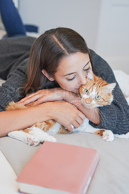 Buy stock photo Woman, cat and kiss on bed in home for love, care and bonding together to relax in the morning. Girl, pet and hug cute ginger feline animal in bedroom for connection, playing and embrace in house