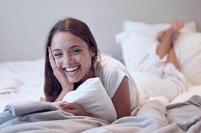 Buy stock photo Shot of a young female laying in bed at home