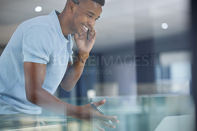 Buy stock photo Shot of a young businessman working in a call centre