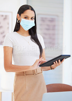 Buy stock photo Shot of a young businesswoman using a digital tablet in her office