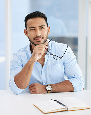 Buy stock photo Asian man, portrait and business confidence at desk with glasses or notebook as architect, interior design or company. Male person, face and creative with startup, entrepreneur or project planning