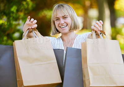 Buy stock photo Woman, shopping bag and excited in portrait at park with smile, discount or deal at retail sale. Girl, person and happy with paper package for sustainability, ecology or customer experience in Berlin