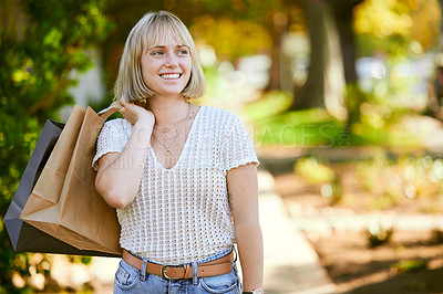 Buy stock photo Woman, shopping bag and excited on walk at park with ideas, discount and deal at retail sale. Girl, person and thinking with paper package for sustainability, ecology or customer experience in Berlin