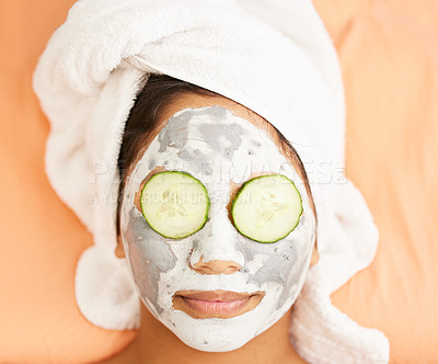 Buy stock photo Home, beauty or woman with face mask, cucumber for cleaning, detox or healthy facial treatment routine. Spa, above or girl with antiaging skincare, wellness or cosmetics for hydration or vitamins