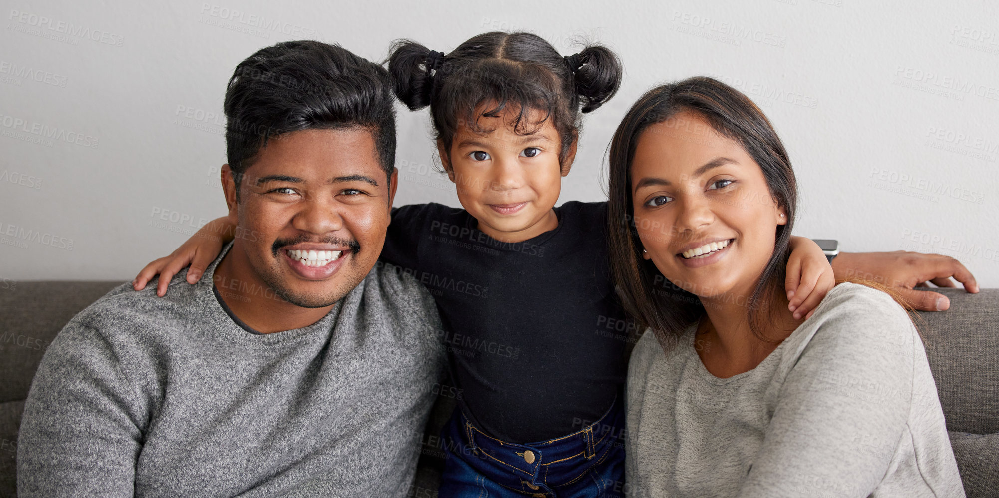 Buy stock photo Shot of a mother and father bonding with their daughter