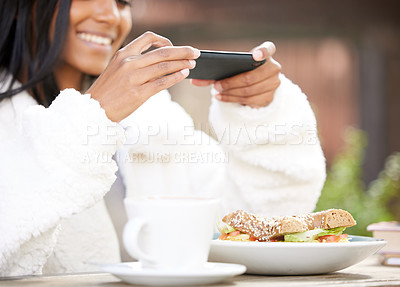 Buy stock photo Shot of a young woman taking a picture of a plate of food