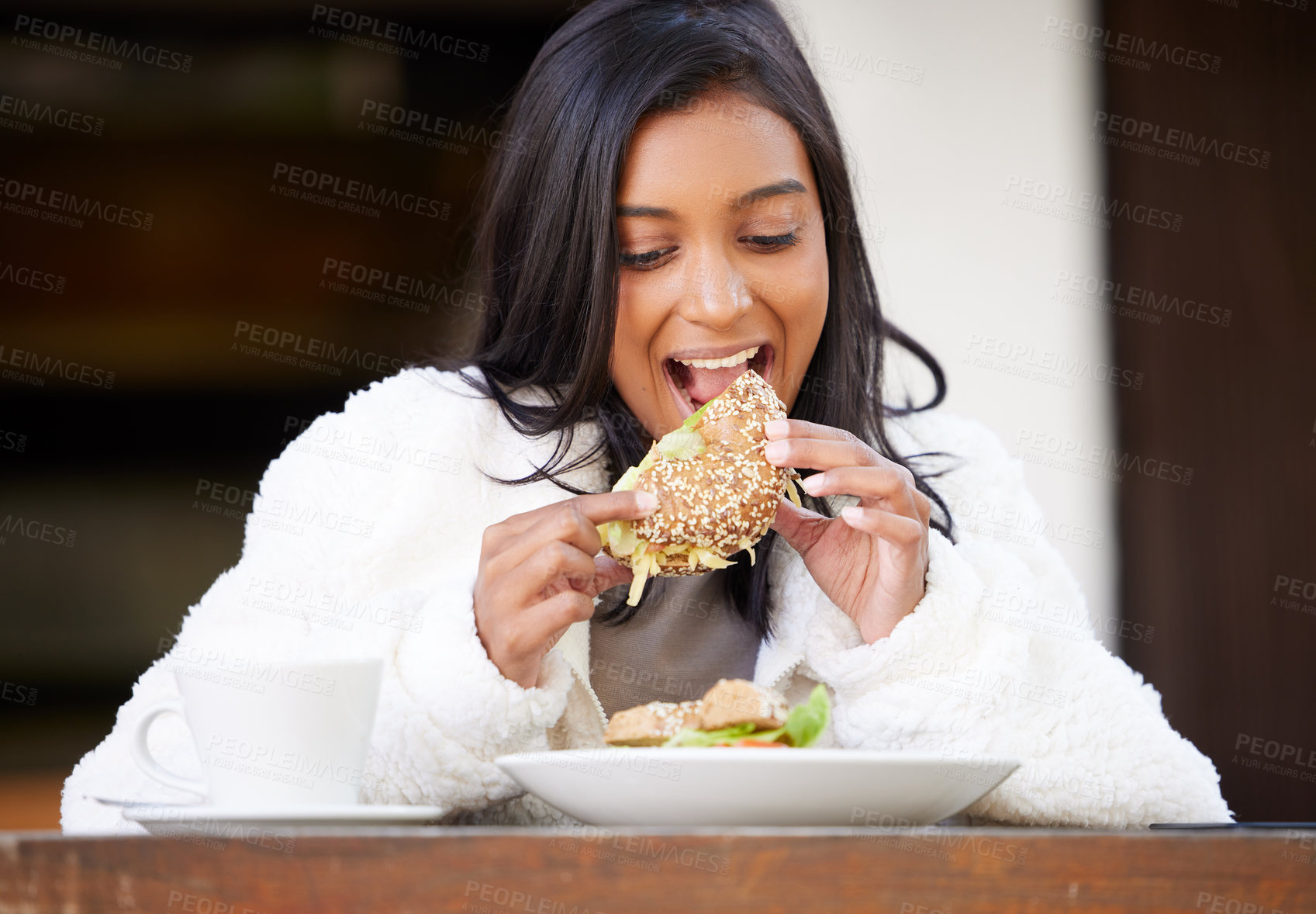 Buy stock photo Food, young woman eating and at restaurant with coffee sitting with a happy smile. Breakfast or lunch time, healthy diet or nutrition and happiness with a female person having a meal at a table 