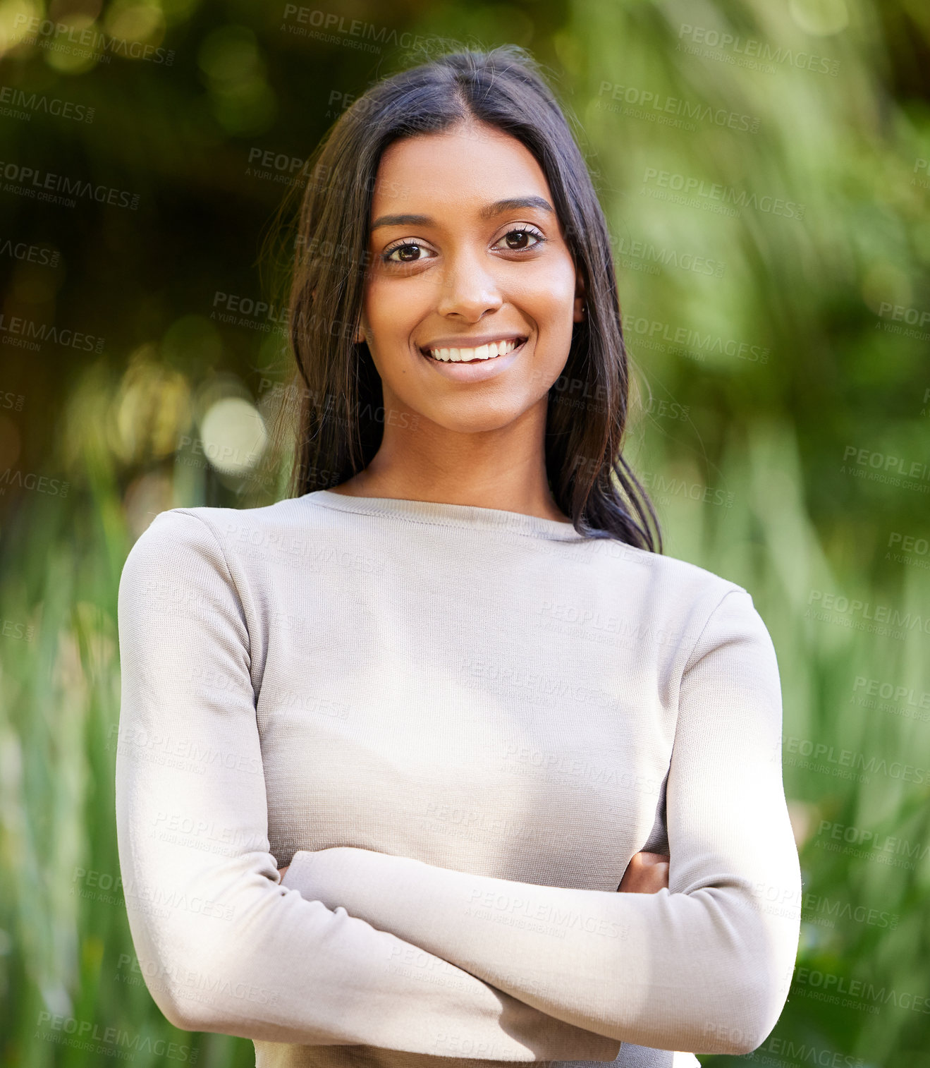 Buy stock photo Girl, portrait and happy with arms crossed in park on vacation, relax and outdoor in nature for adventure. Woman, smile and confident person with pride, garden or holiday in spring by trees in Mumbai