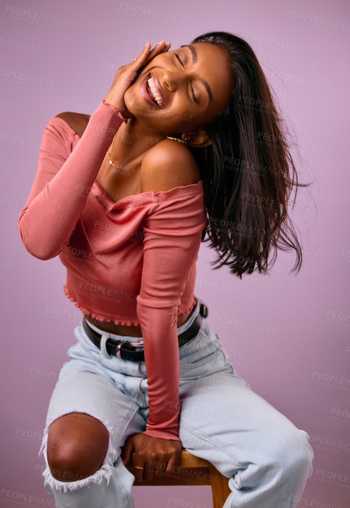 Buy stock photo Indian woman, fashion and style in studio, chair and jewelry or confident on purple background. Female person, aesthetic and designer outfit or accessories, play and proud female person in clothes