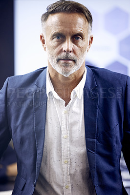 Buy stock photo Shot of a mature businessman standing in a boardroom at work