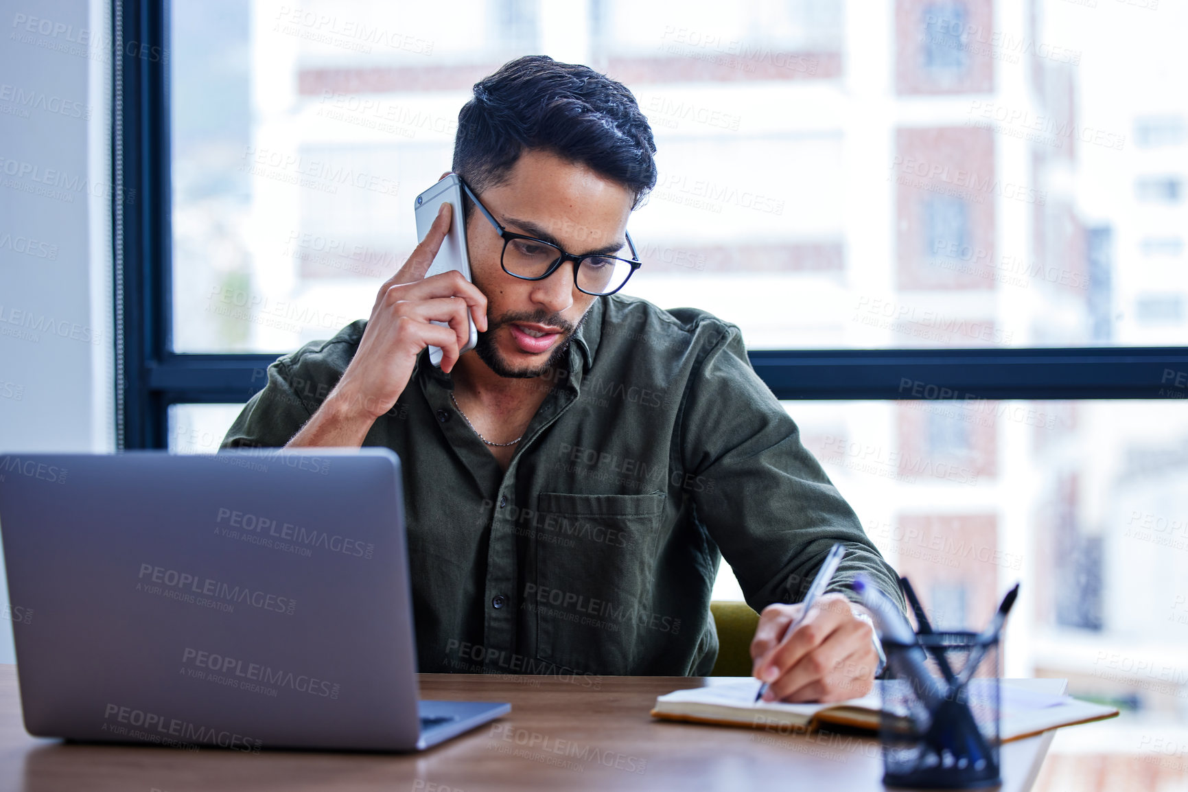 Buy stock photo Businessman, phone call and notebook for planning in workplace for writing, agenda and networking. Male person, listen and connect in creative agency for talking, notes and conversation in office