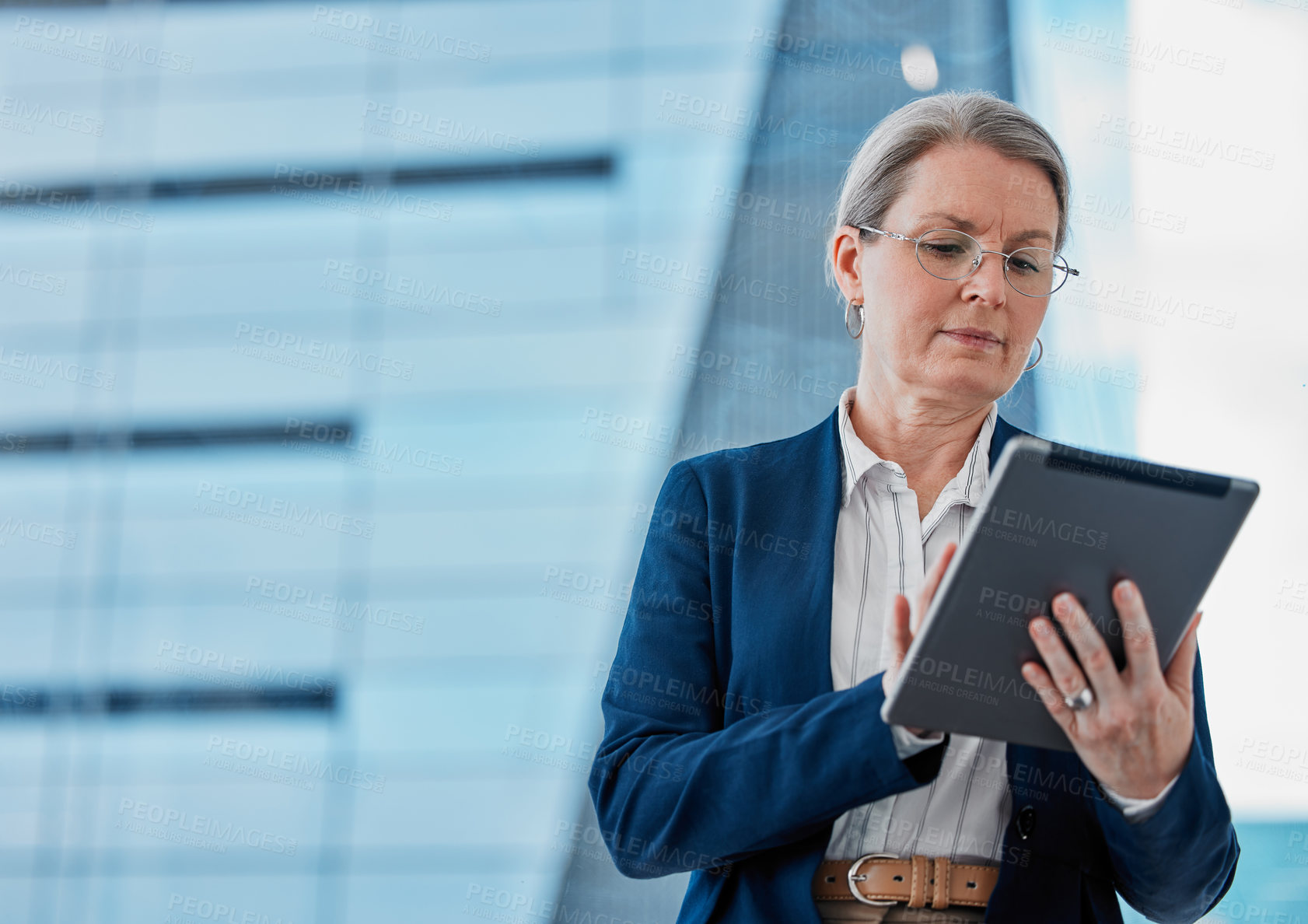 Buy stock photo Mature businesswoman, tablet and career for online report, digital website or streaming in office. Professional person or manager and serious with tech for internet app and corporate success in job