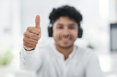 Buy stock photo Closeup shot of an unrecognisable businessman showing thumbs up in an office