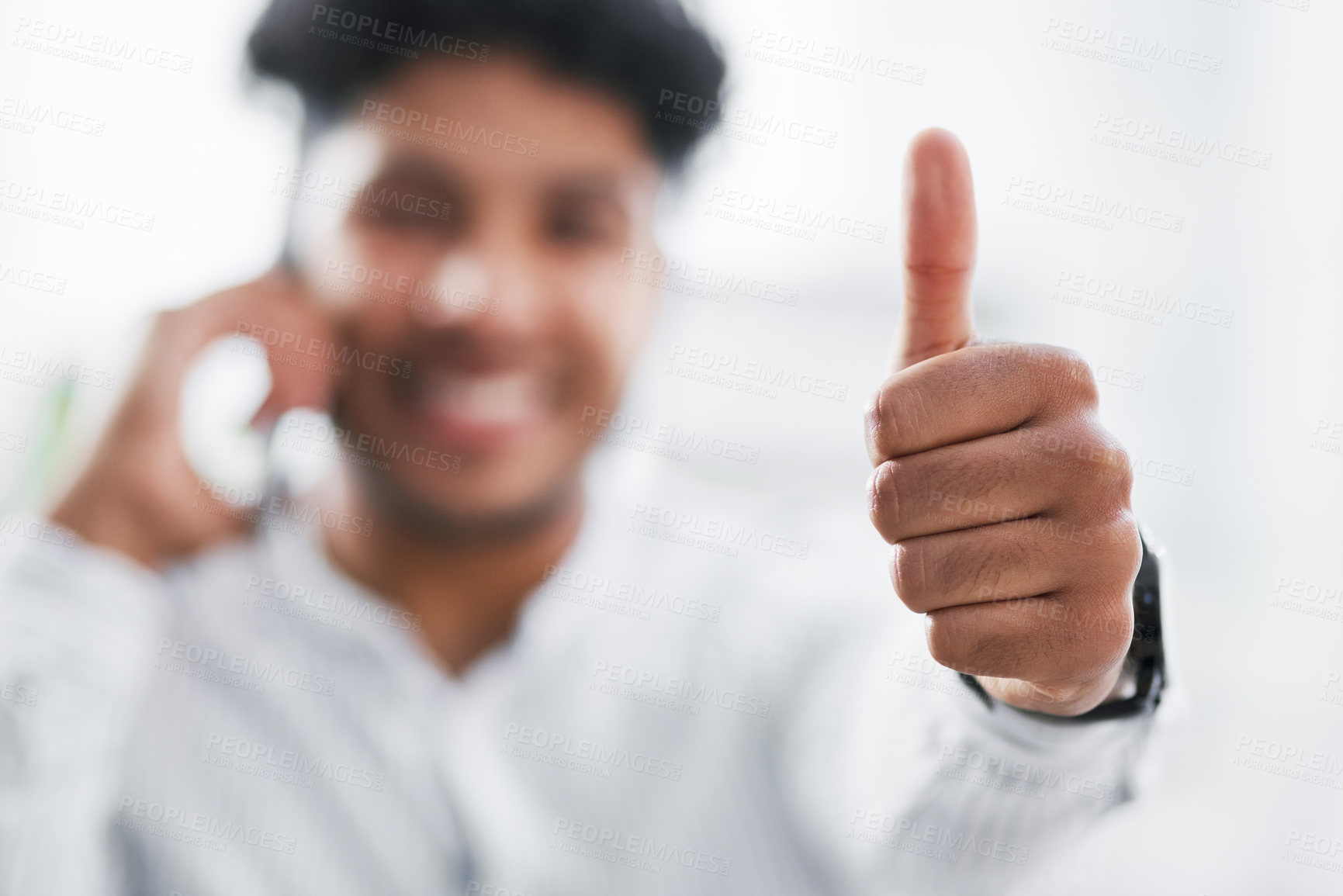 Buy stock photo Closeup shot of an unrecognisable businessman showing thumbs up in an office