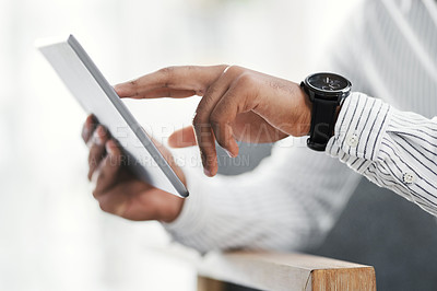 Buy stock photo Closeup shot of an unrecognisable businessman using a digital tablet in an office