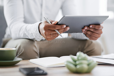 Buy stock photo Closeup shot of an unrecognisable businessman using a digital tablet in an office