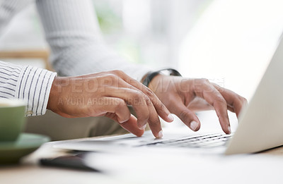 Buy stock photo Closeup shot of an unrecognisable businessman using a laptop in an office