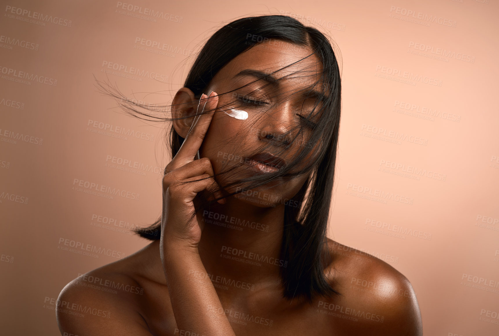 Buy stock photo Woman, skincare or lotion with moisturizer for beauty cosmetics on a brown studio background. Female person, model or hydration with cream for soft skin facial, dermatology or anti aging treatment