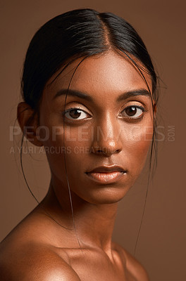 Buy stock photo Portrait of a beautiful young woman posing against a brown background