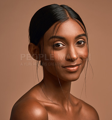 Buy stock photo Portrait of a beautiful young woman posing against a brown background