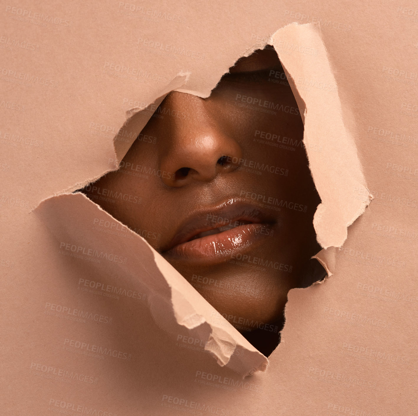 Buy stock photo Closeup shot of an unrecognizable woman tearing through brown paper