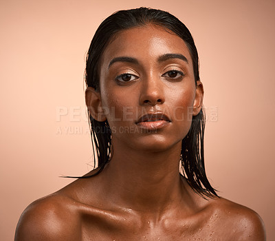 Buy stock photo Portrait of a beautiful young woman after having a refreshing shower against a brown background