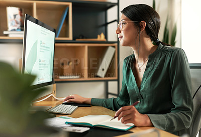 Buy stock photo Shot of a young businesswoman looking at her computer screen at work