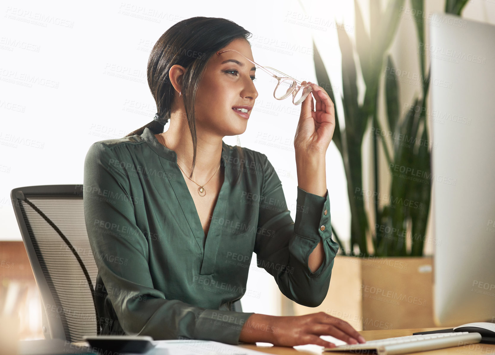 Buy stock photo Shot of a young businesswoman typing on her desktop PC keyboard