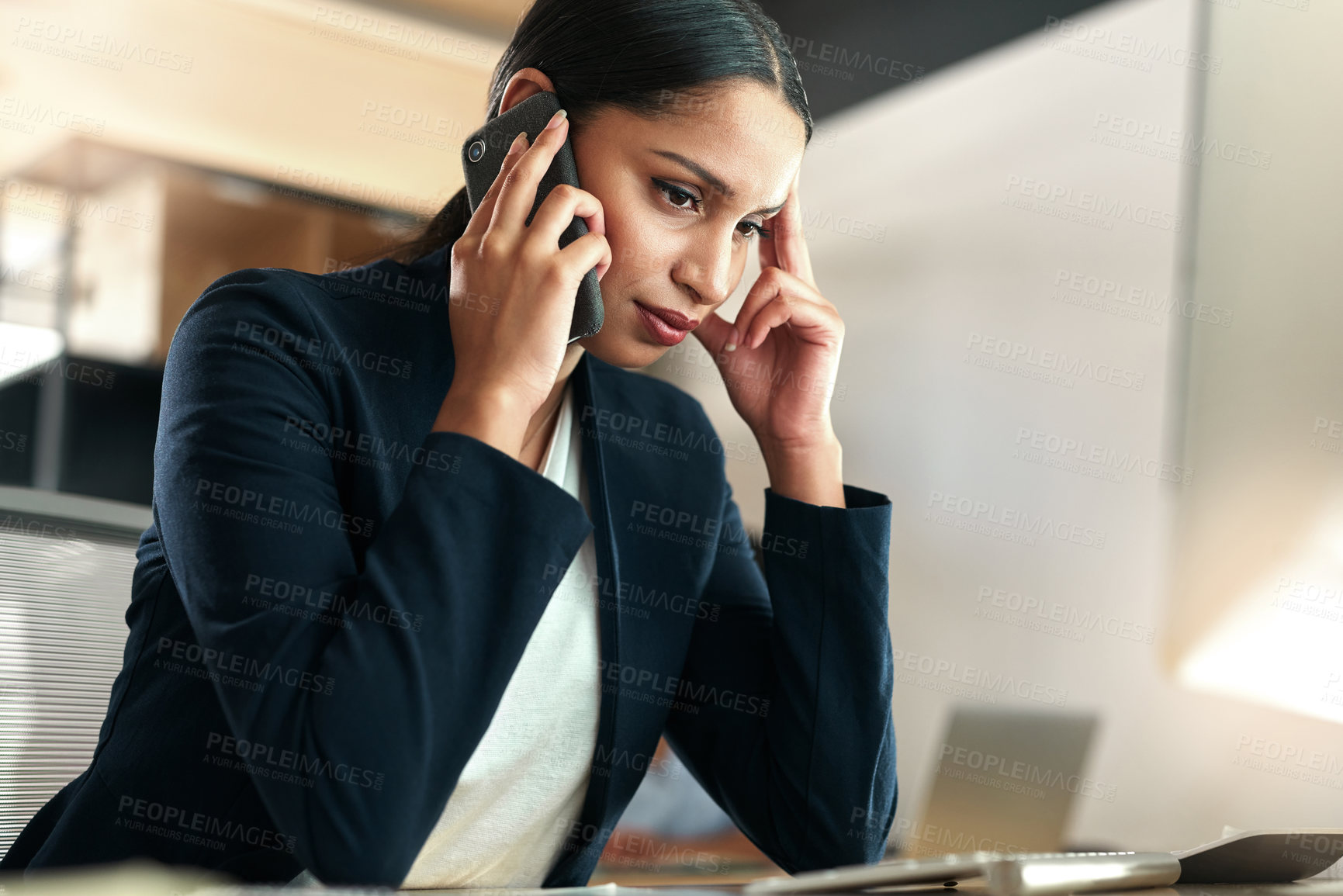 Buy stock photo Shot of a young businesswoman experiencing a headache at work