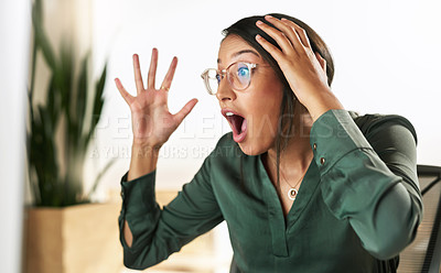 Buy stock photo Shot of a young businesswoman looking at her PC screen in shock