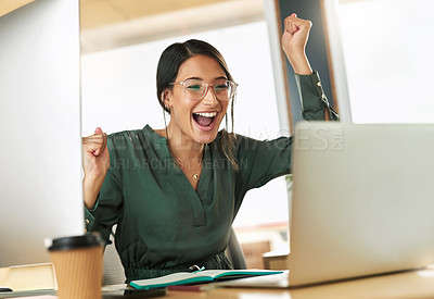 Buy stock photo Shot of a young businesswoman cheering during a video conference at work