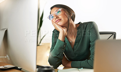 Buy stock photo Shot of a young businesswoman staring at her PC screen in boredom