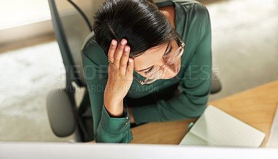 Buy stock photo Shot of a young businesswoman sitting at her desk