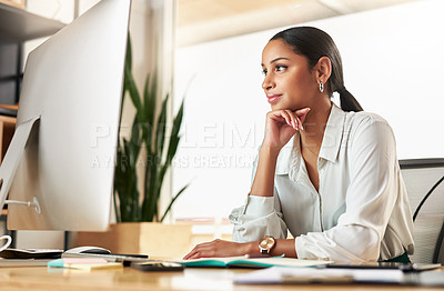 Buy stock photo Shot of a young businesswoman using her desktop PC at work
