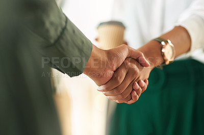 Buy stock photo Shot of two businesswoman shaking hands in greeting