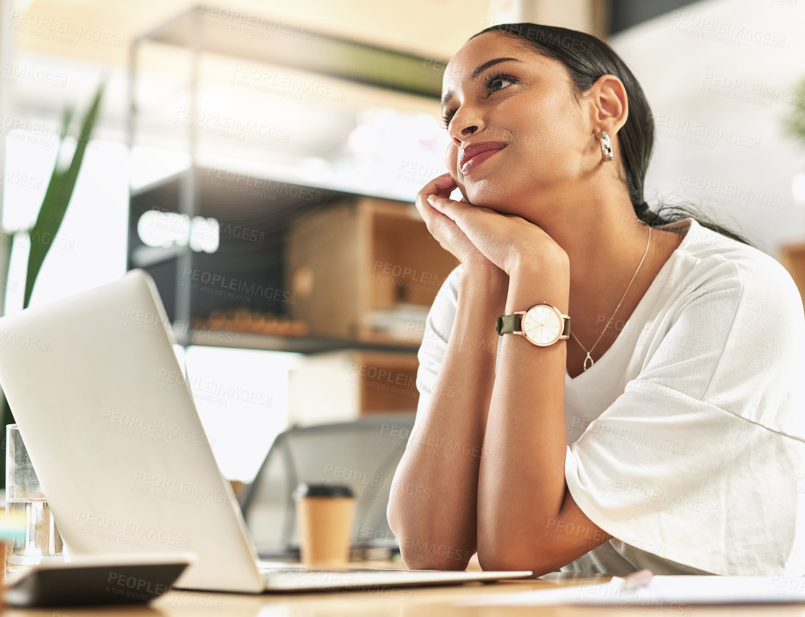 Buy stock photo Shot of a young businesswoman day dreaming at her desk